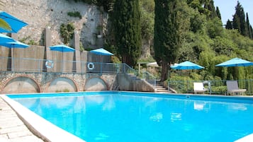 Seasonal outdoor pool, pool umbrellas, pool loungers