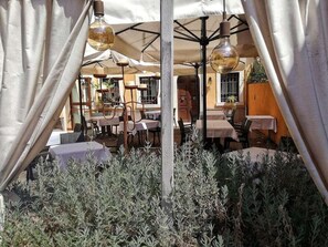 Breakfast, lunch, dinner served; local cuisine, garden views