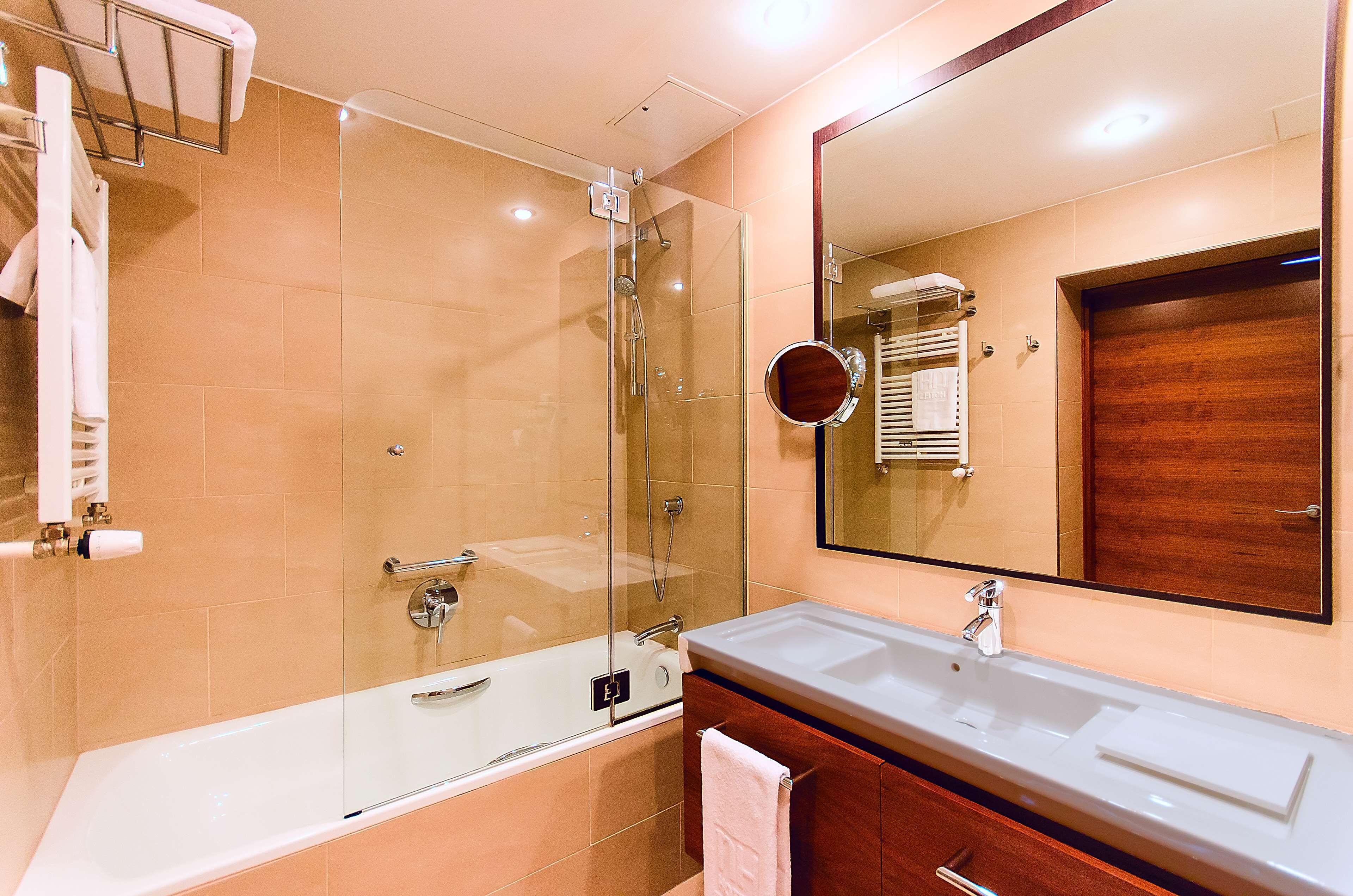 deep-soaking bathtub, eco-friendly toiletries, hair dryer, towels