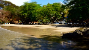 Private beach, white sand, sun loungers, beach umbrellas