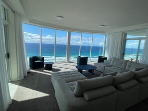Three Bedroom Ocean View Suite | Living area | LCD TV, DVD player, iPod dock - Carmel by the Sea (Broadbeach)