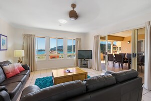 Luxury Penthouse, 3 Bedrooms | Living area | 40-inch Smart TV with satellite channels