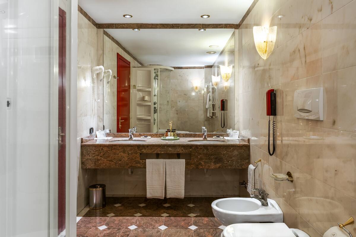 luxury suite | bathroom | free toiletries, hair dryer, slippers, bidet