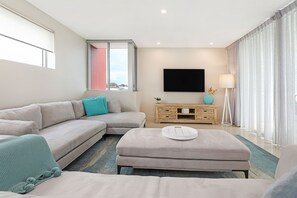 Three Bedroom Apartment | Living area | 42-inch flat-screen TV with satellite channels, TV - Element on Coolum Beach (Coolum Beach)