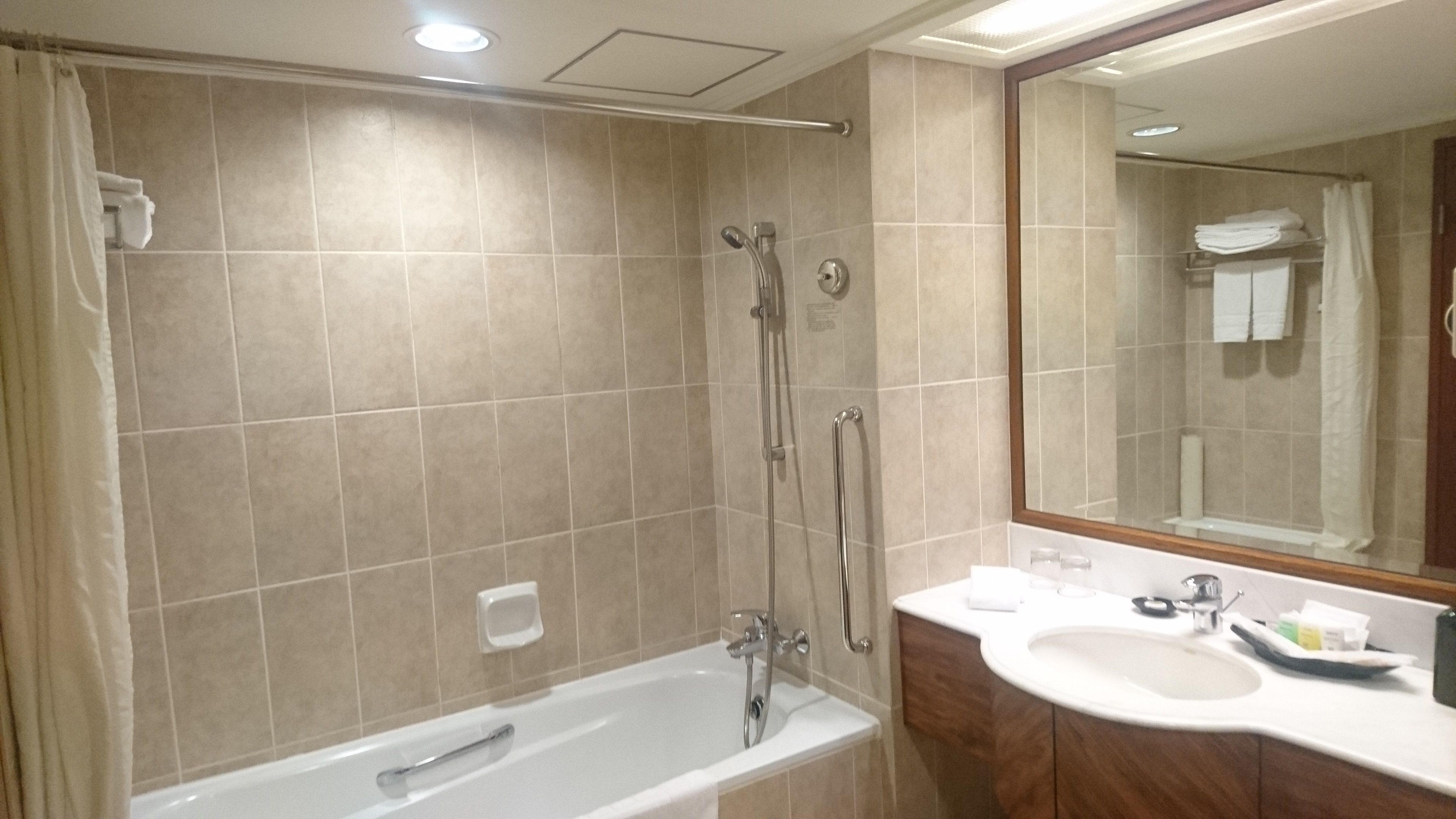 combined shower/bathtub, deep-soaking bathtub, hair dryer, bathrobes