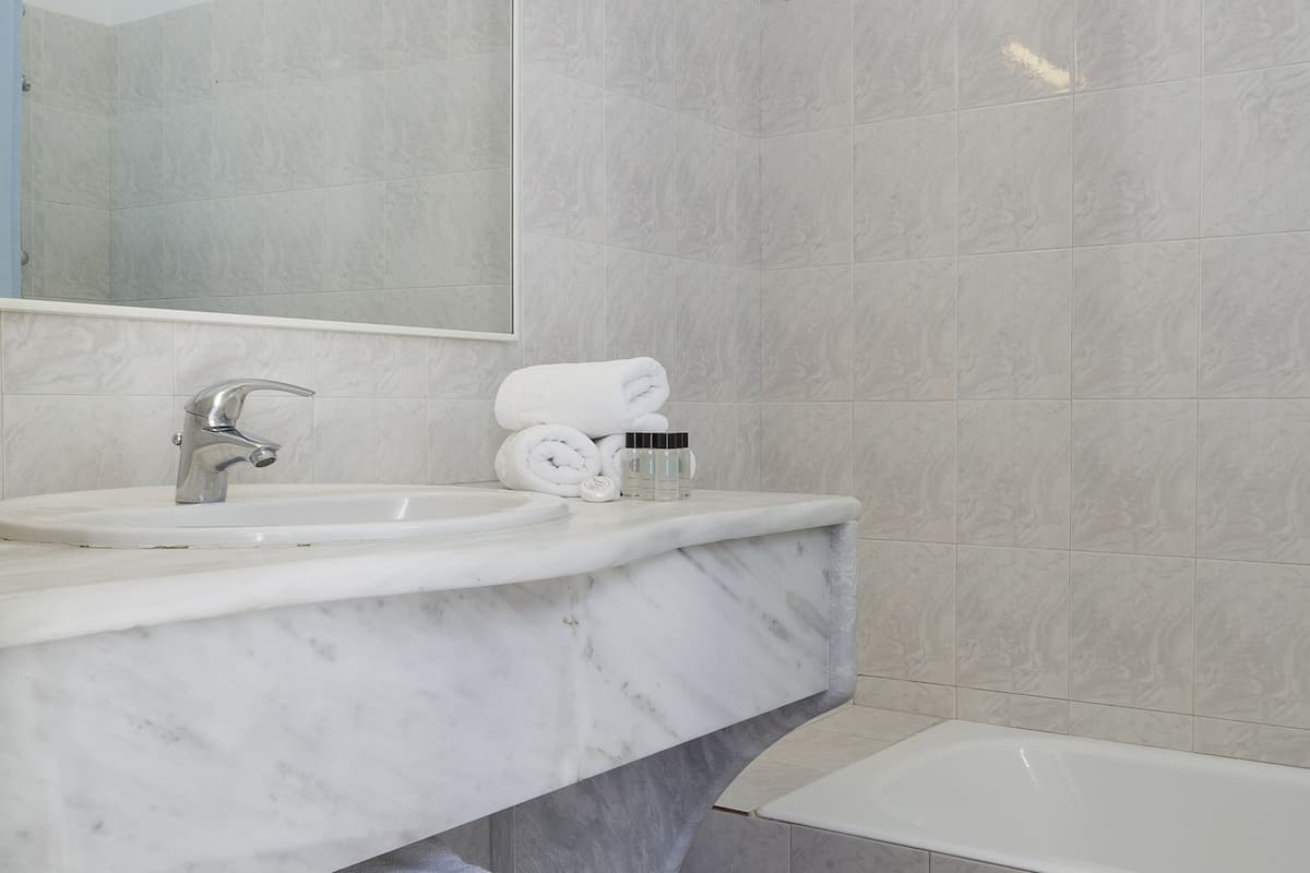 family suite, pool view | bathroom | free toiletries, hair dryer, towels