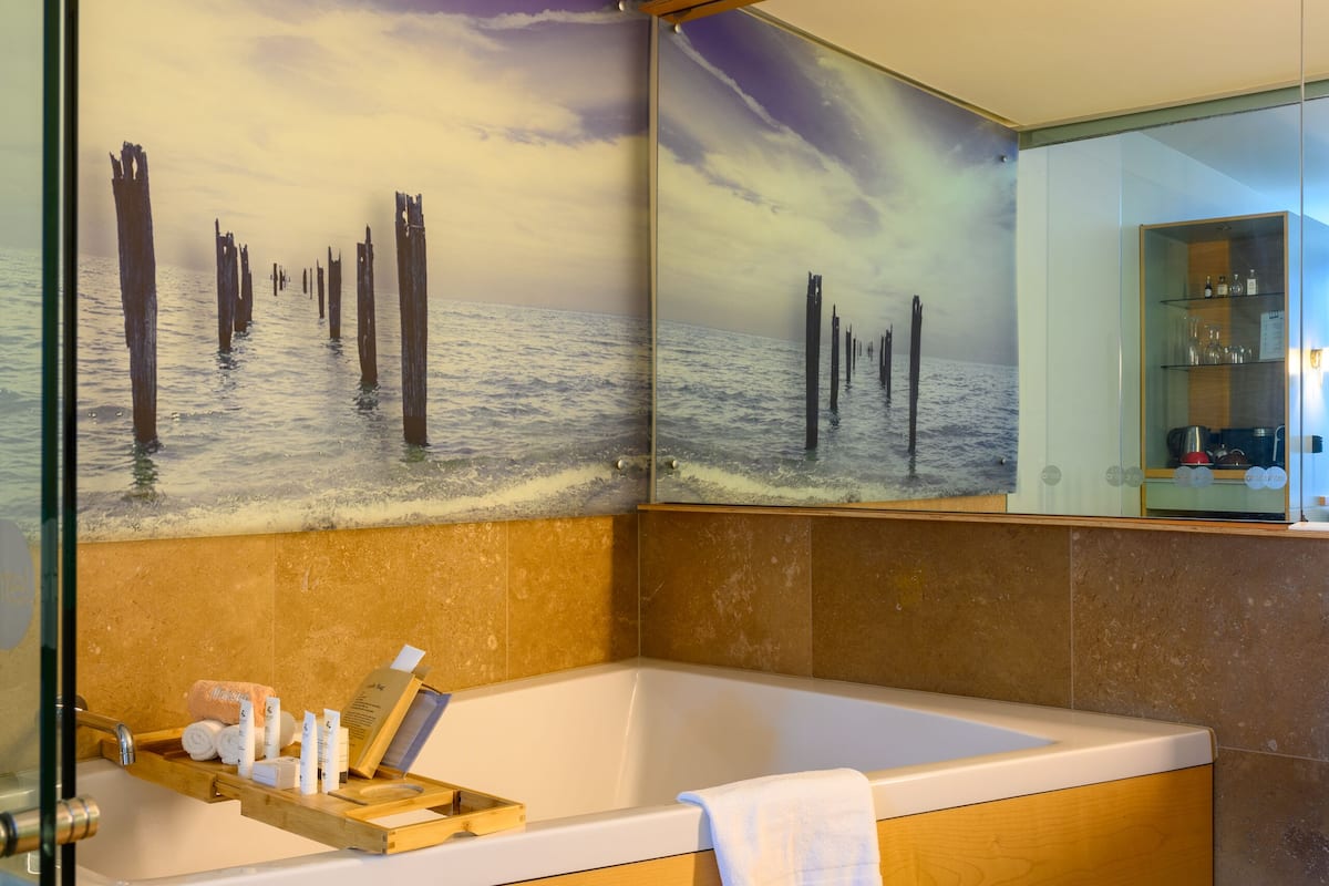 deluxe | bathroom | eco-friendly toiletries, hair dryer, bathrobes, slippers