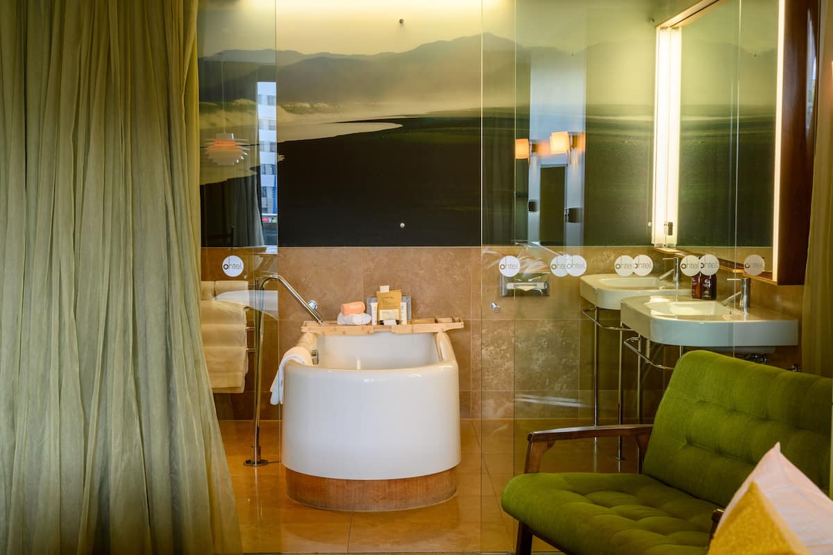 premium double room, 1 king bed, balcony, city view | bathroom | eco-friendly toiletries, hair dryer, bathrobes, slippers