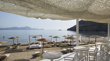 On the beach, sun-loungers, beach umbrellas, beach towels