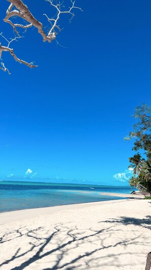 Private beach, white sand, sun loungers, beach umbrellas