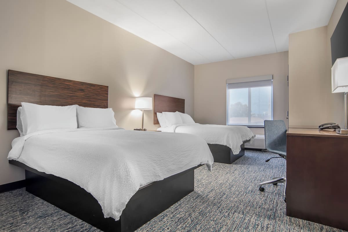 Pillowtop beds, desk, blackout drapes, iron/ironing board