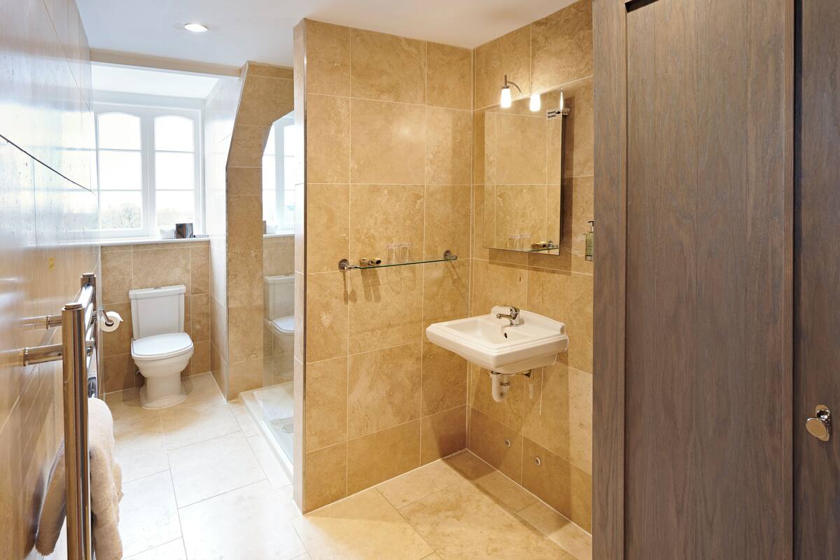 standard king (cozy king) | bathroom | designer toiletries, hair dryer, towels, shampoo