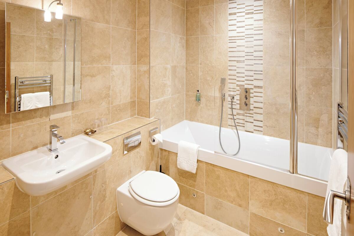superior room | bathroom | designer toiletries, hair dryer, towels, shampoo