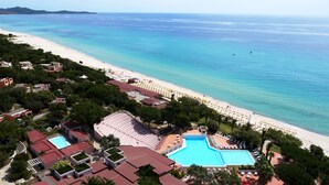 An aerial view of a resort with a large pool, beach, and ocean. - TH Costa Rei - Free Beach Club (Muravera)