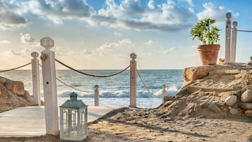 Private beach, white sand, sun loungers, beach umbrellas