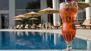 Outdoor pool, open 6:00 AM to 10:00 PM, pool umbrellas, pool loungers