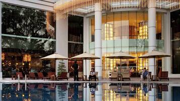 Outdoor pool, open 6:00 AM to 10:00 PM, pool umbrellas, sun loungers