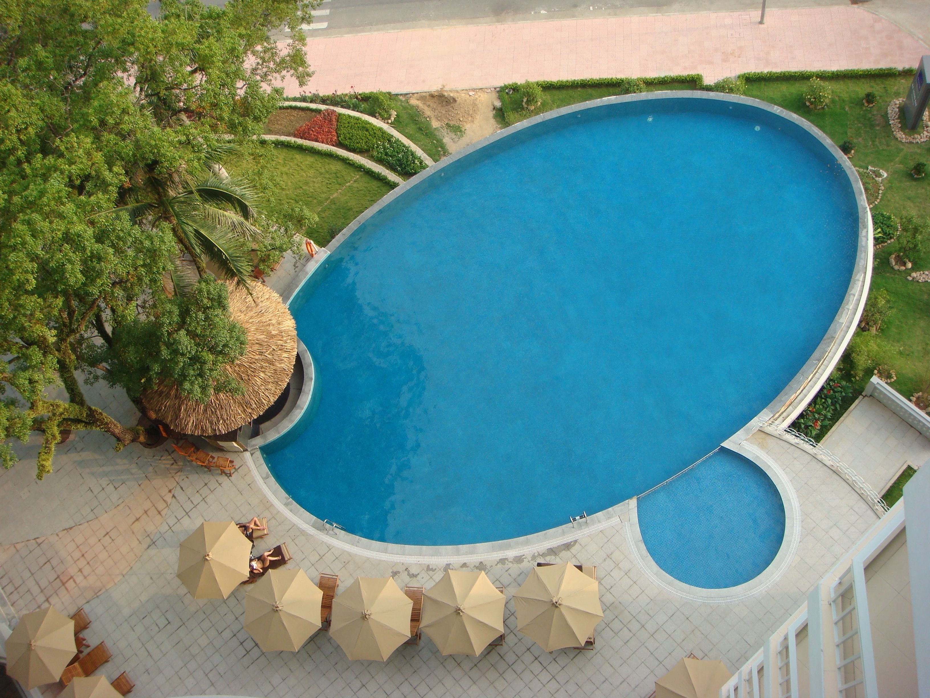 Outdoor pool, open 6:00 AM to 10:00 PM, pool umbrellas, sun loungers