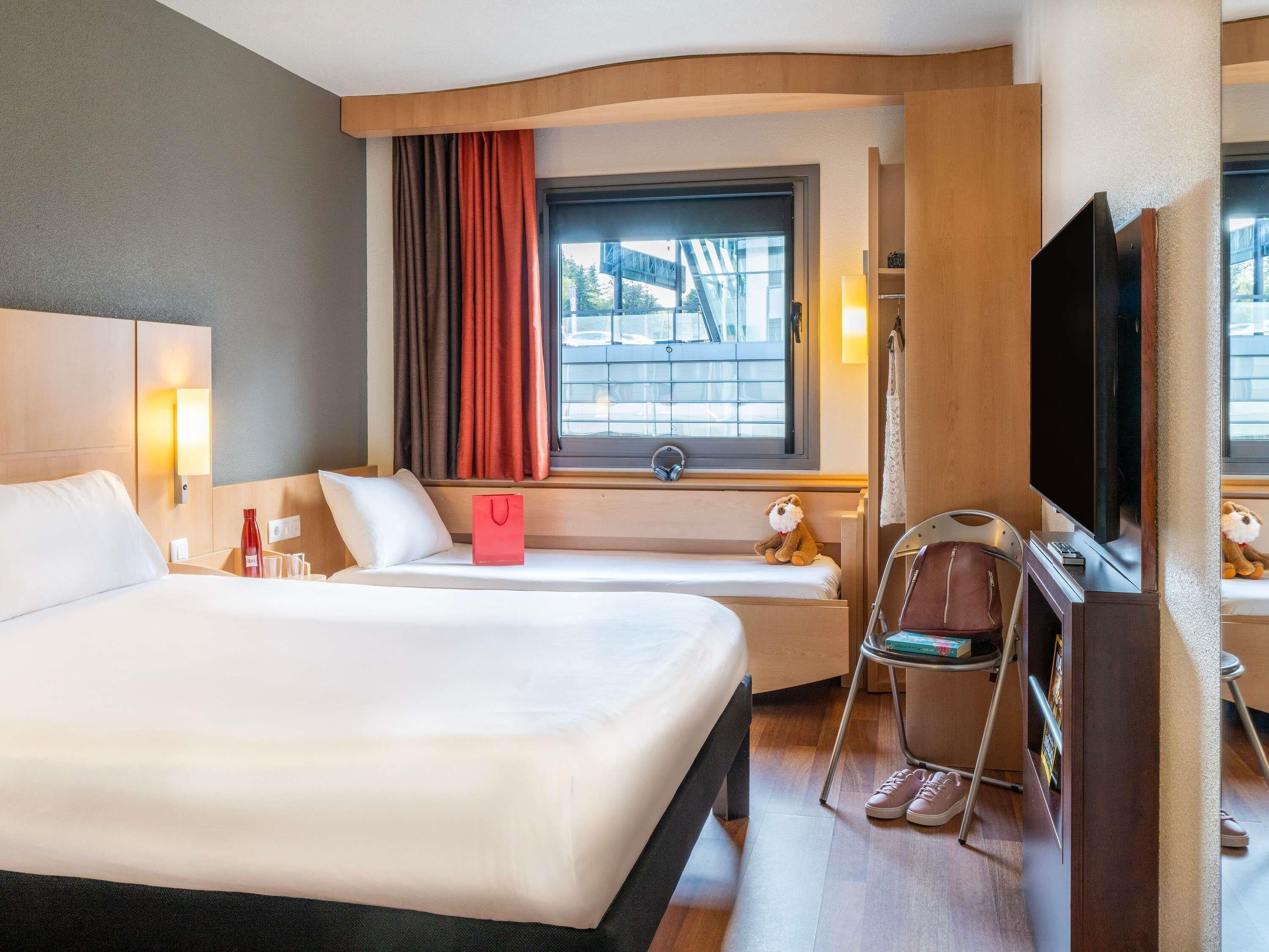 Room, Multiple Beds | Down duvets, in-room safe, desk, blackout curtains