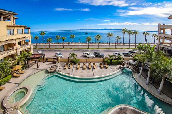 Outdoor pool, open 9:00 AM to 10:30 PM, pool umbrellas, sun loungers