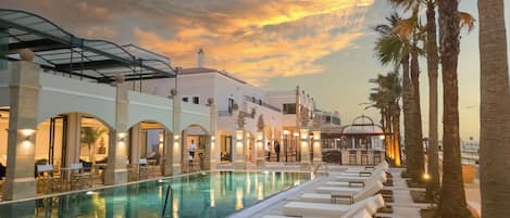 Indoor pool, seasonal outdoor pool, pool umbrellas, pool loungers