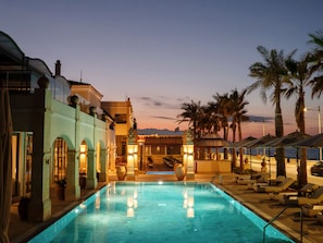 Indoor pool, seasonal outdoor pool, pool umbrellas, pool loungers