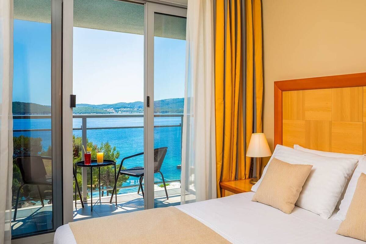 family room with seaside balcony | 1 bedroom, minibar, in-room safe, desk