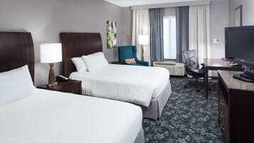 Premium bedding, desk, laptop workspace, blackout curtains