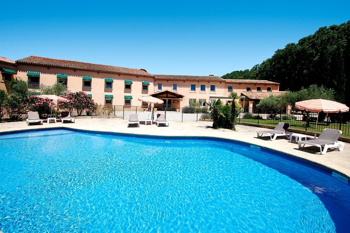 Outdoor pool, open 8:00 AM to 8:00 PM, pool umbrellas