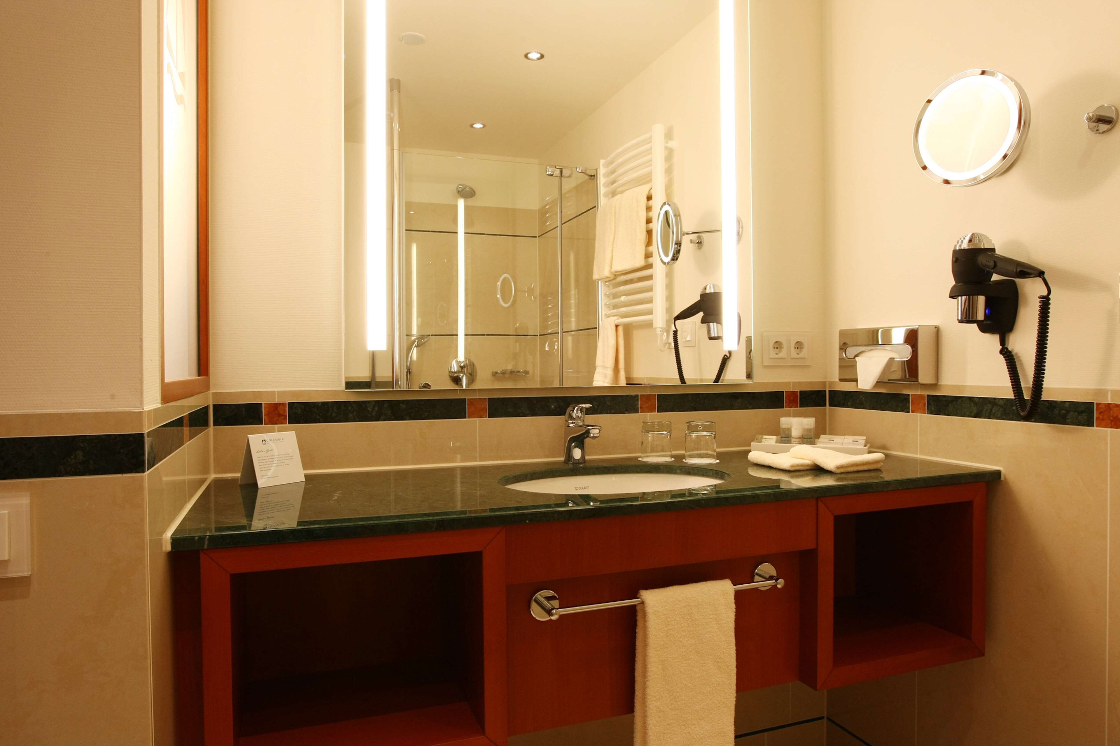 superior room | bathroom | shower, free toiletries, hair dryer, bathrobes