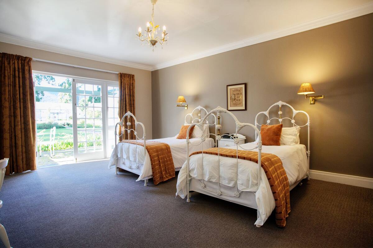 two twin beds | in-room safe, individually decorated, individually furnished