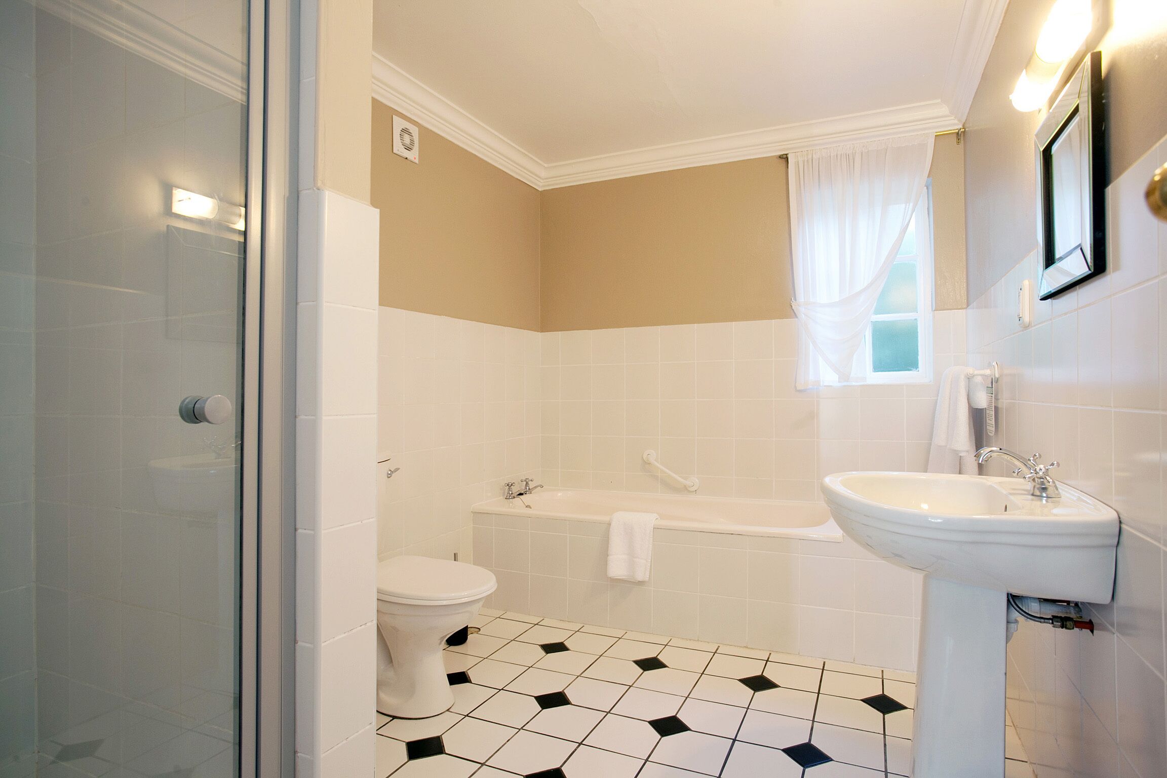 two twin beds | bathroom | separate bathtub and shower, hair dryer, towels, soap
