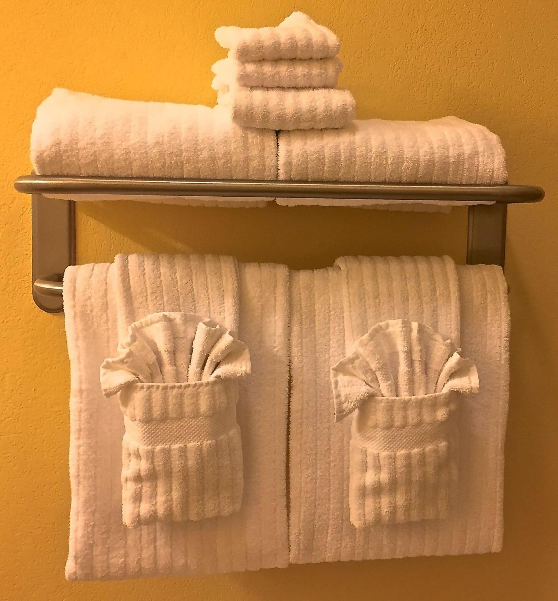 shower, designer toiletries, hair dryer, towels