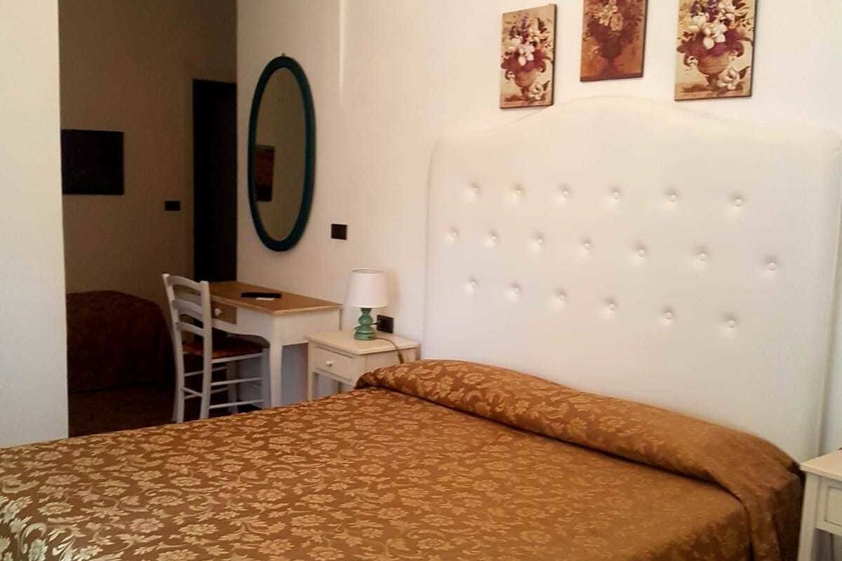 Economy Triple Room | Minibar, in-room safe, desk, iron/ironing board (on request)