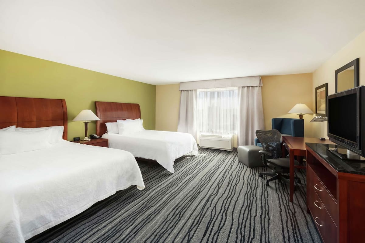 Down comforters, pillowtop beds, in-room safe, desk