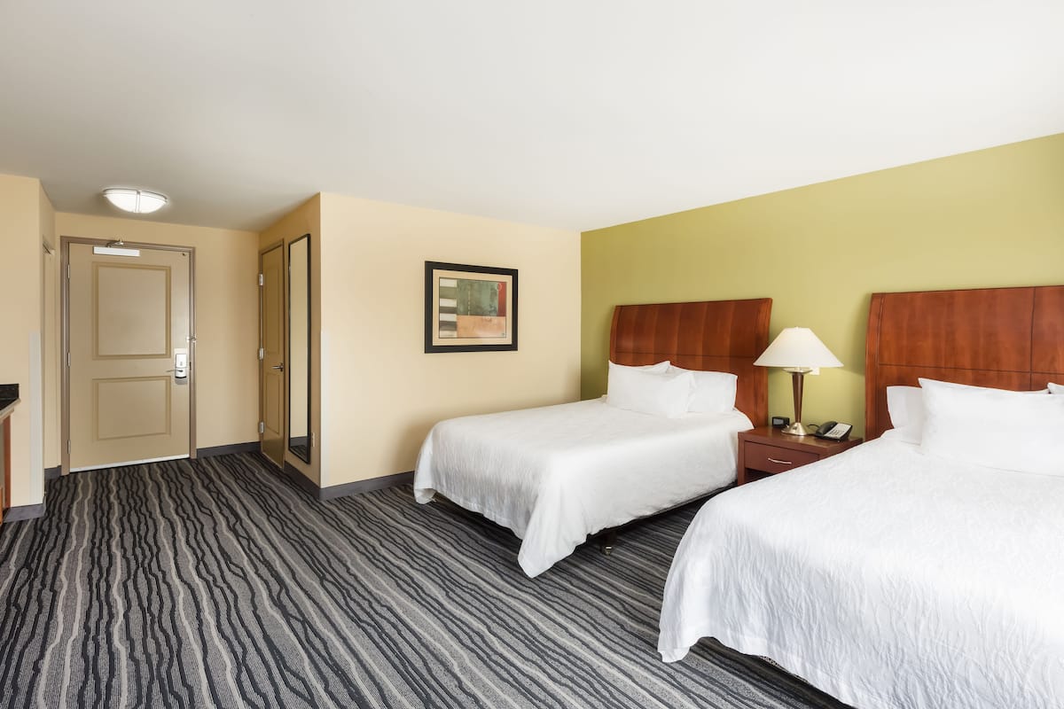 Down duvets, pillow-top beds, in-room safe, desk