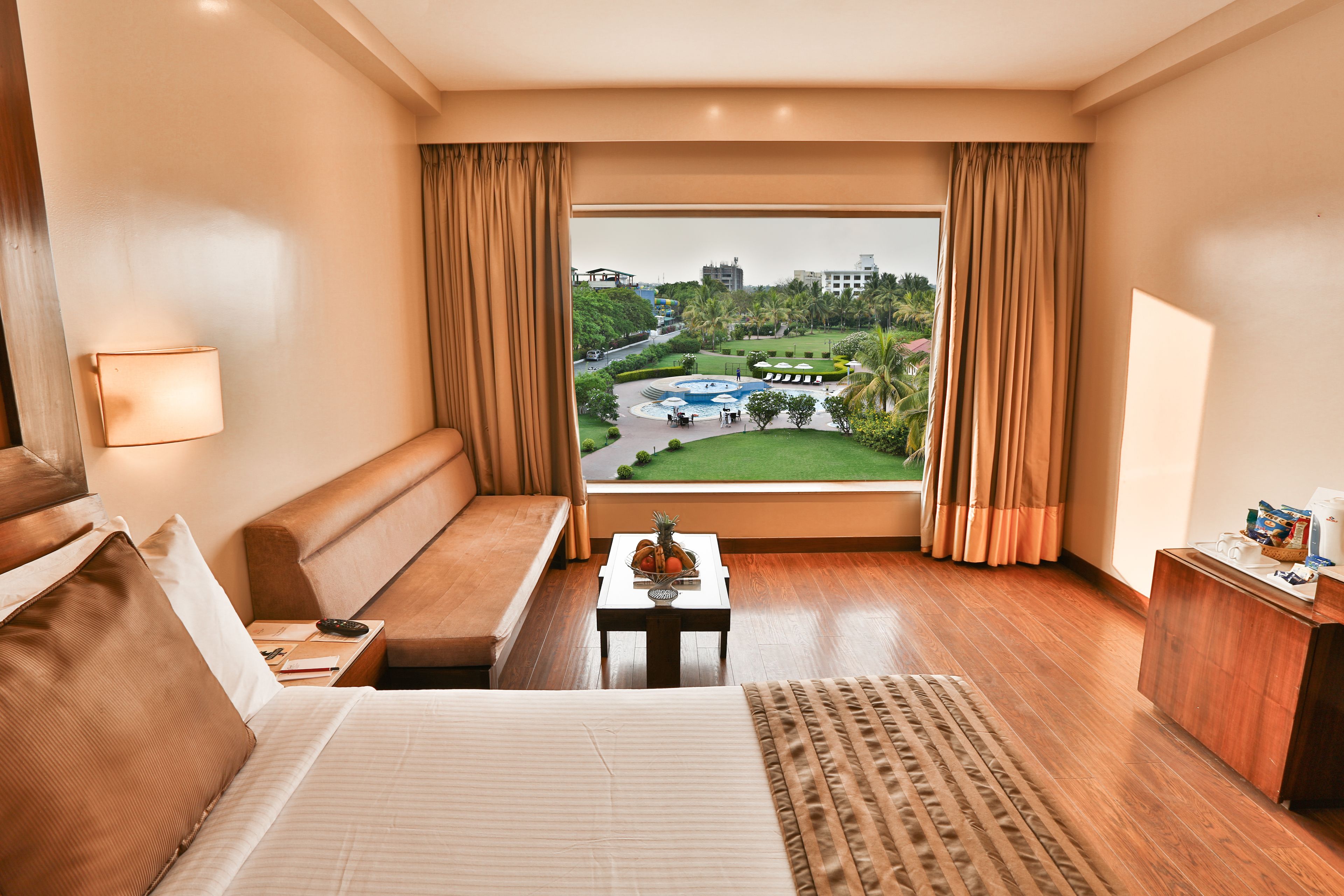 Superior Room, Pool View | Minibar, in-room safe, desk, laptop workspace