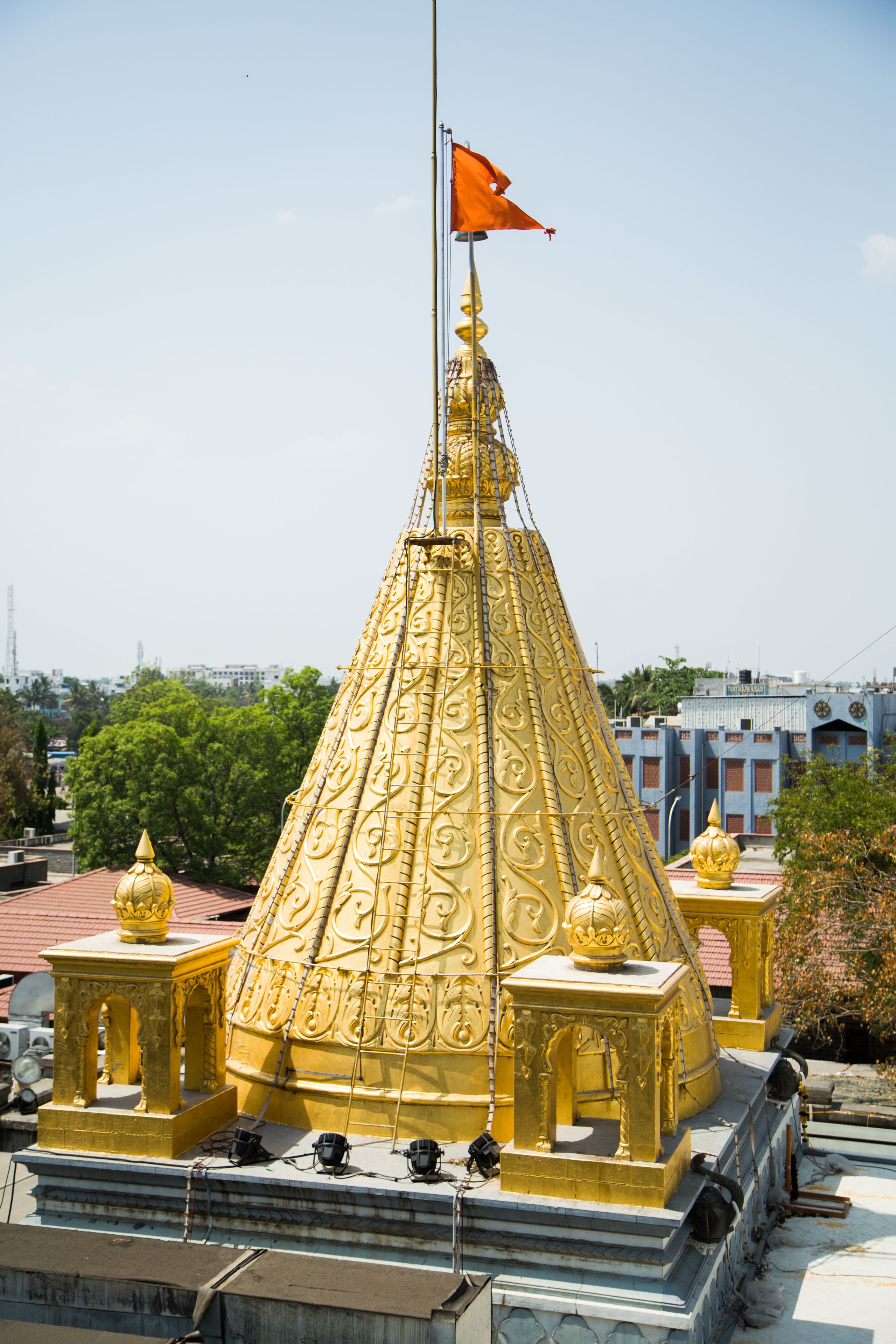 A golden structure with a flag, surrounded by smaller golden elements and a base platform.