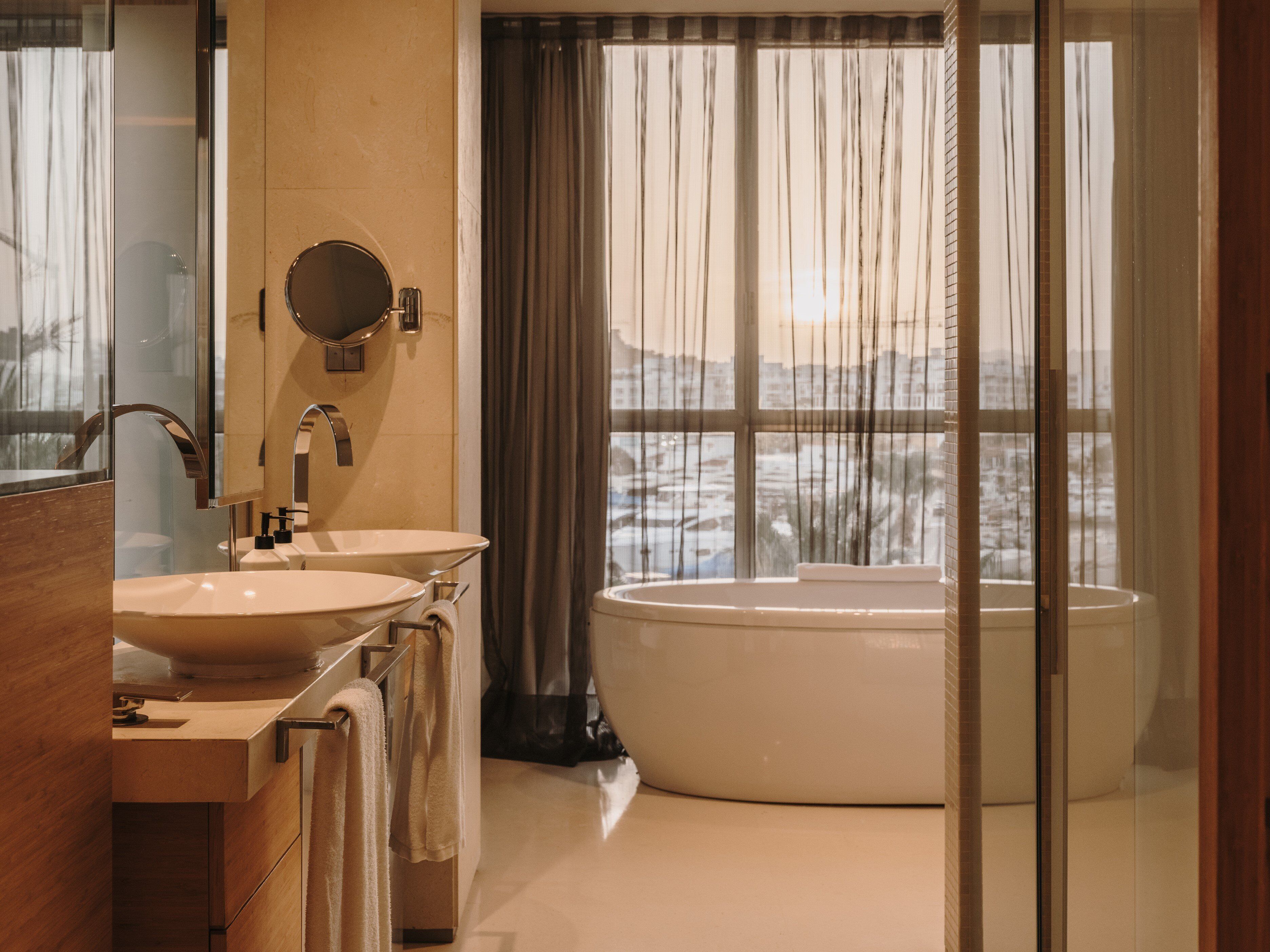 combined shower/bathtub, rainfall showerhead, designer toiletries