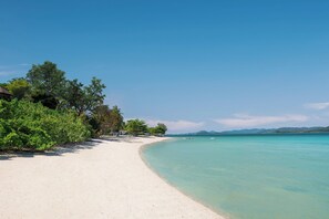 Private beach, white sand, sun loungers, beach umbrellas - The Naka Island, a Luxury Collection Resort & Spa, Phuket (Pa Klok)