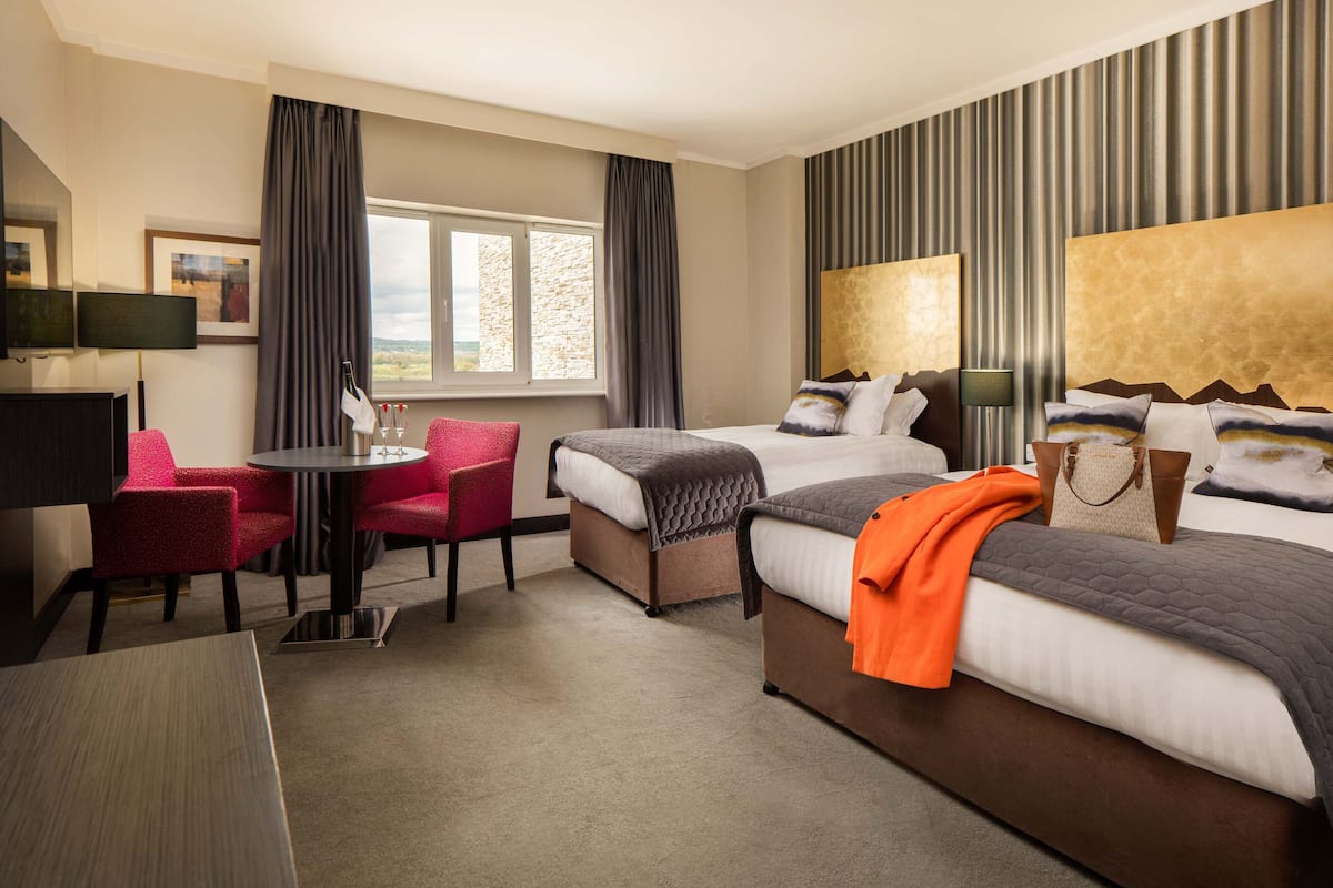 premium bedding, desk, blackout curtains, iron/ironing board