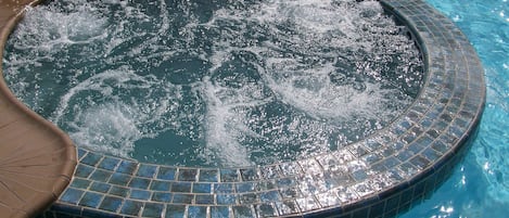 Outdoor pool, open 7 AM to 10 PM, pool umbrellas, pool loungers