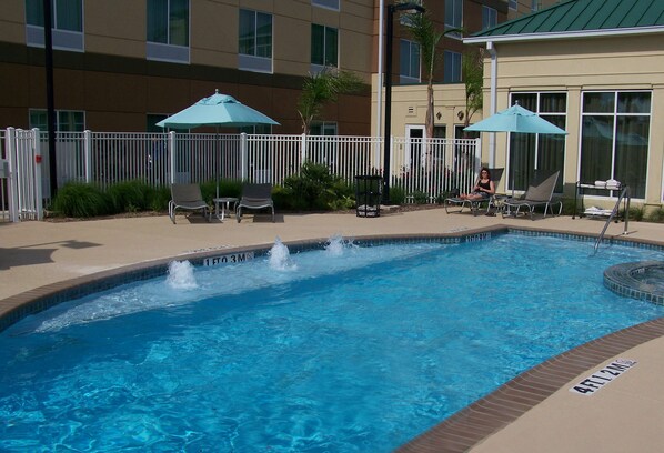 Outdoor pool, open 7 AM to 10 PM, pool umbrellas, pool loungers