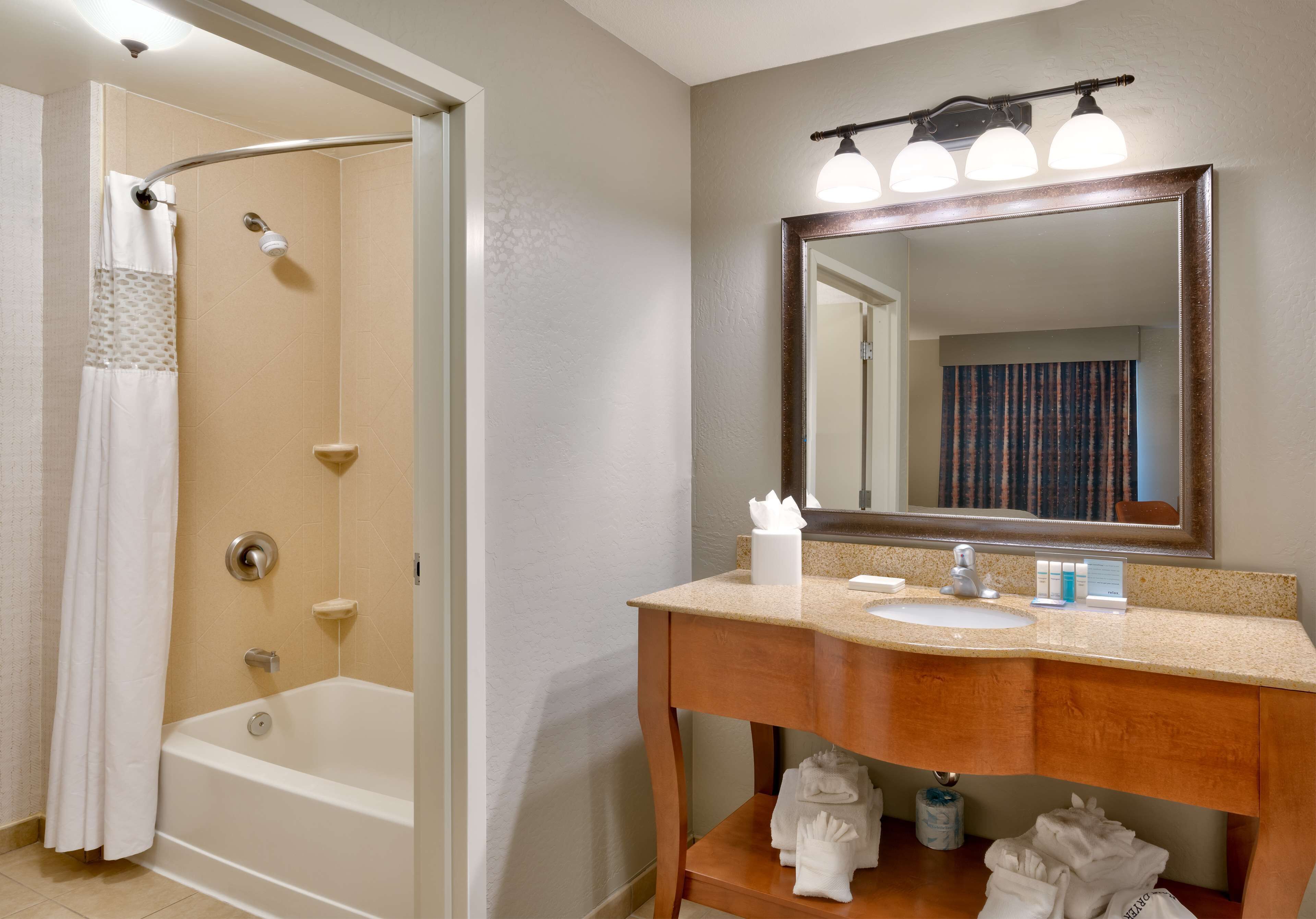 bathtub, hair dryer, towels