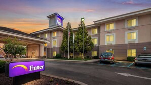 A hotel entrance with a 'Sleep' sign, a 'Clearance Rd' sign, and a '1784' sign. - Sleep Inn & Suites Dover University Area (Dover)