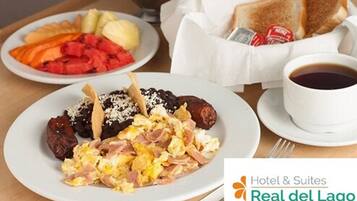 A breakfast setting with plates of food, toast, and a cup of coffee.