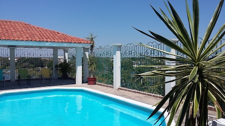 Outdoor pool, open 8:00 AM to 8:00 PM, sun loungers