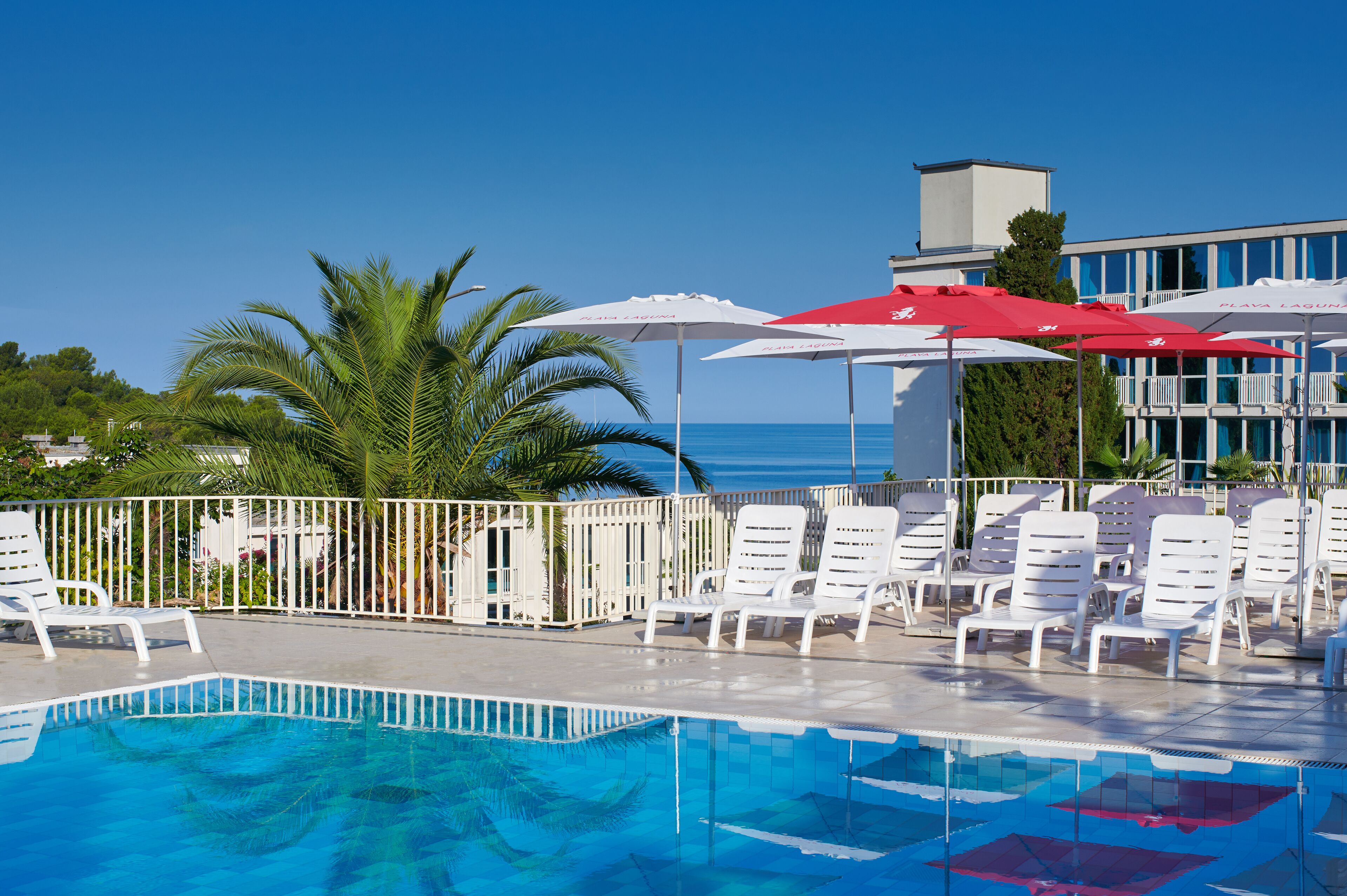 seasonal outdoor pool, pool umbrellas, pool loungers