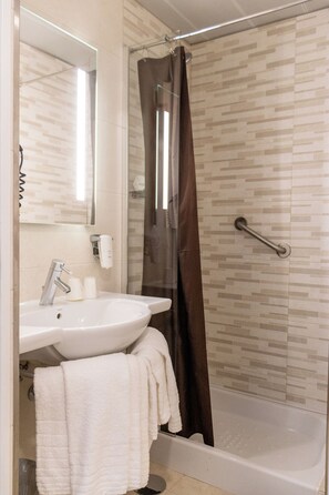 Shower, free toiletries, hair dryer, slippers