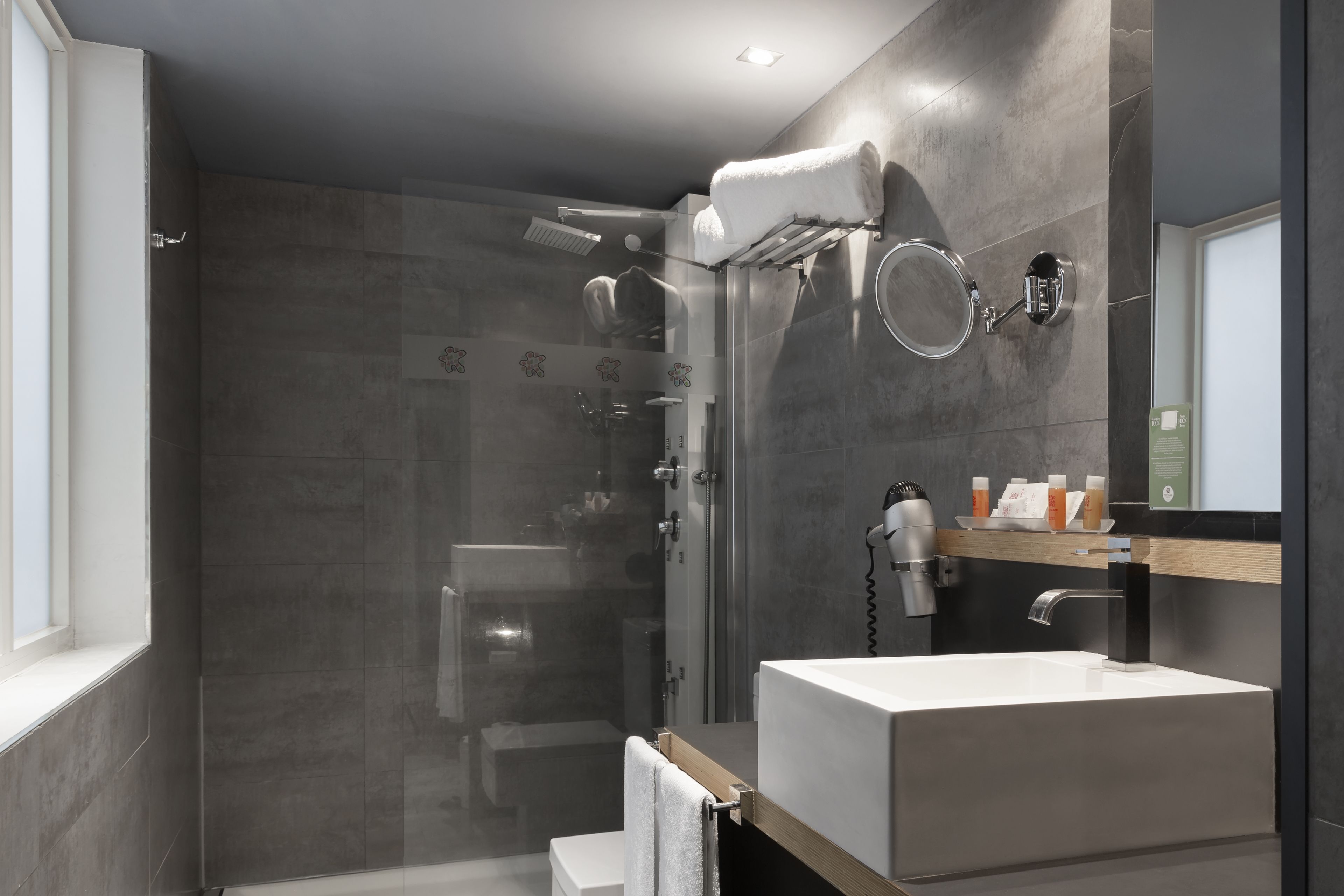 eco-friendly toiletries, hair dryer, towels